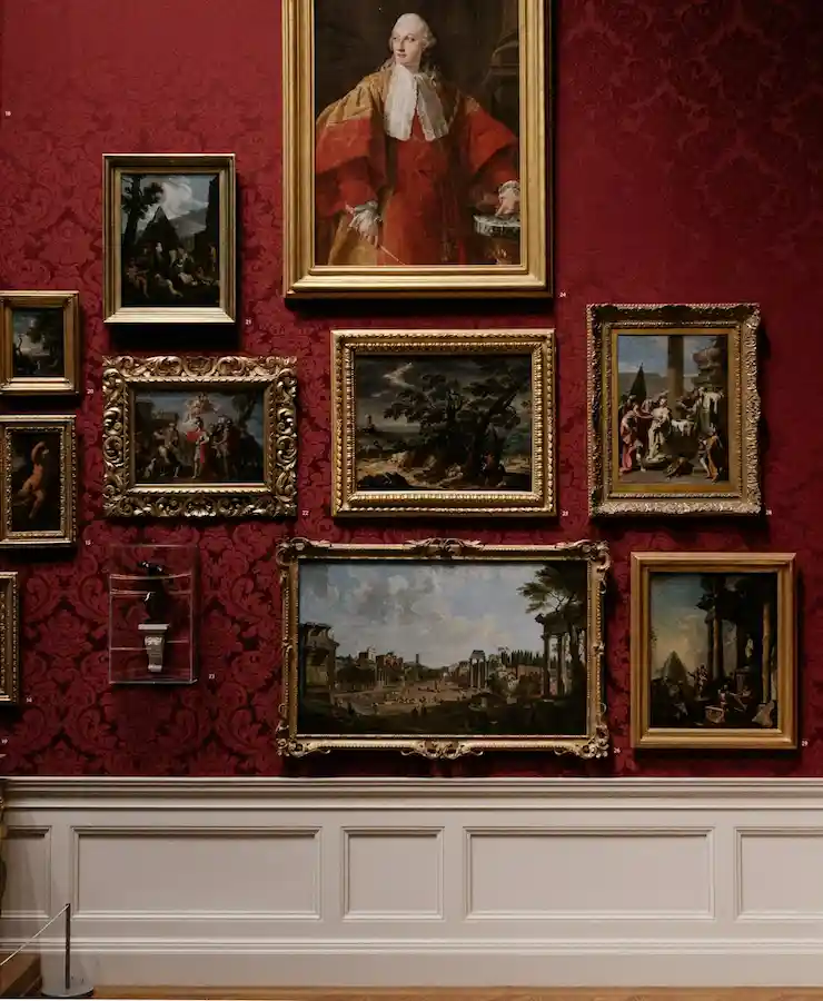 Background image of a collage of paintings on a wall